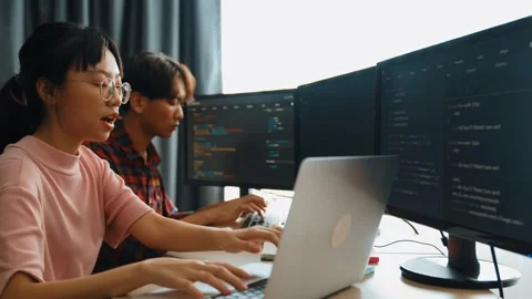 Back end software developer engineer writing code. Burgeoning Stock Footage 265612191