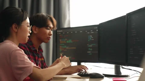Back end software developer engineer writing code. Burgeoning Stock Footage 267467227