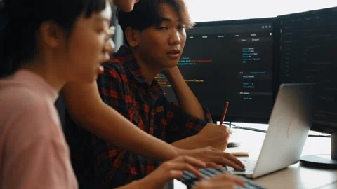 Back end software developer engineer writing code. Burgeoning Stock Footage 272887548