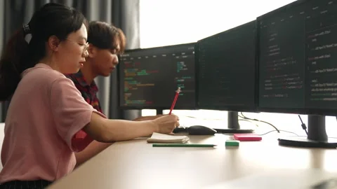 Back end software developer engineer writing code. Burgeoning Stock Footage 274632999
