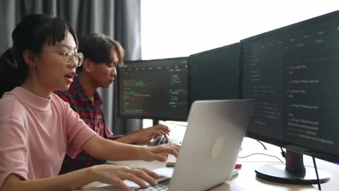 Back end software developer engineer writing code. Burgeoning Stock Footage 274905308