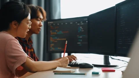 Back end software developer engineer writing code. Burgeoning Stock Footage 279509453