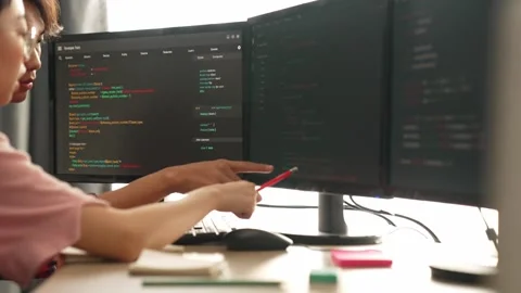 Back end software developer engineer writing code. Burgeoning Stock Footage 281113662