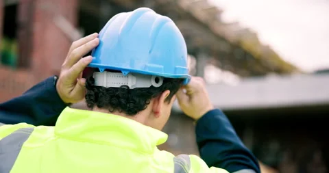 Back, engineer and inspection at construction site with hard hat, safety and Stock Footage 337026396