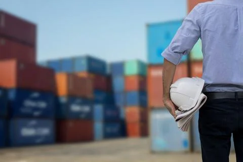 Back of engineer holding white helmet Business Logistics concept, Foreman c.. Stock Photos