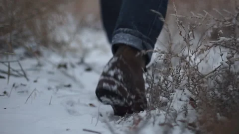 Back of Feet Walking Through Snow Stock Footage 210977010