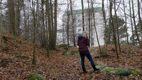 Back of Female Standing and Checking Her Phone in Forest Stock Footage 99219246