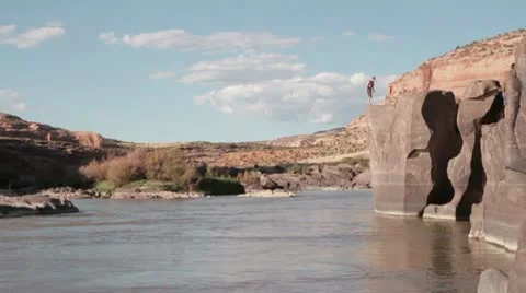 Back Flip of Rock into River (SLOW MO) Video stock 9059676