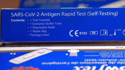 Back of a Flowflex autotest self diagnosis test box to detect Covid-19 Stock Footage 168250089