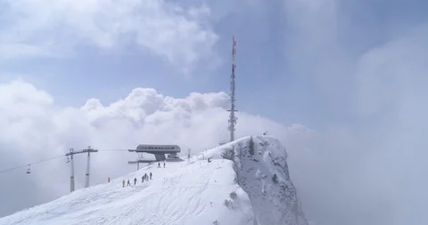 Back fly in the clouds, Villars top lift - Aerial 4K Stock Footage 106293409