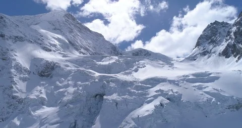 Back fly from glacier de Tsijiore Nouve and Pigne d'Arolla - Aerial 4K Stock Footage 106187232
