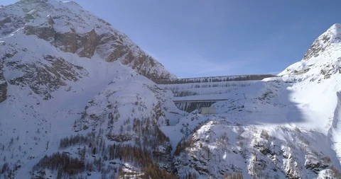 Back fly Grande Dixence in winter - Aerial 4K Stock Footage 106151791