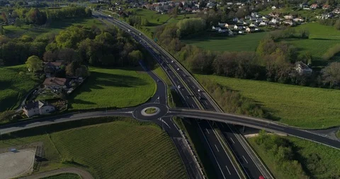 Back fly from traffic circle in Blonay / la Chiésaz - Aerial 4K Stock Footage 107042283