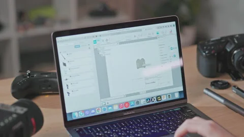 Back footage of clever young programmer sitting at laptop, working on drone Stock Footage 186162236