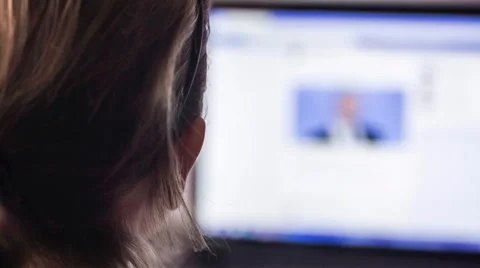 Back of girls head in front of computer monitor. Stock Footage 58696603