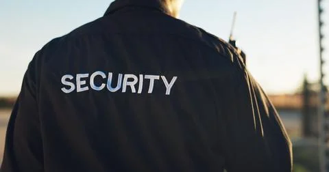 Back, guard and security with uniform outdoor for surveillance, authority a.. Stock Photos