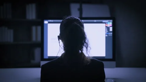 The back of the hacker call center working with computer at night Stock Footage 158237201
