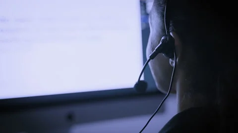 The back of the hacker call center working with computer at night Stock Footage 159732456