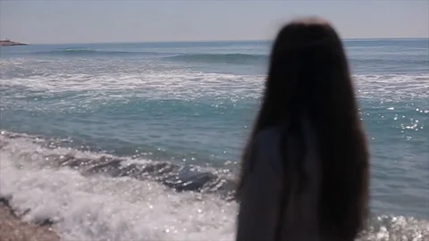 Back half-body view of a beautiful girl looking at the sea Stock-Footage 95944031