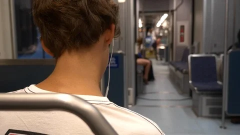 Back of head of boy passenger on subway train with out-of-focused background. Stock Footage 107950306