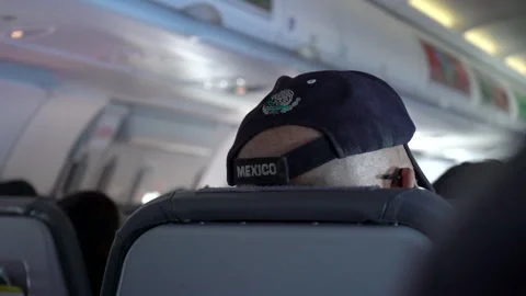 Back of head passenger sit in Aircraft cabin inside commercial airline. Stock Footage 166533898