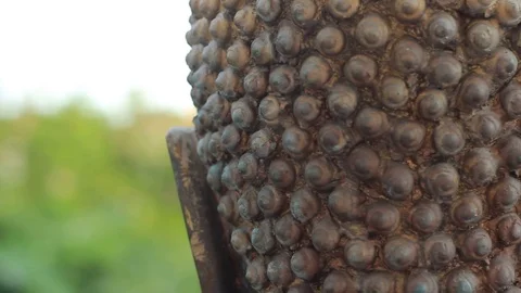 The back of the head of a Thai Buddha statue in temple grounds in a Wat Stock Footage 101635387