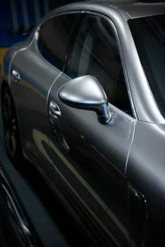 Back headlight of  luxury gray metallic car auto detail in the garage Stock Photos