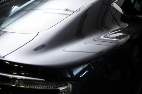Back headlight of  luxury gray metallic car auto detail in the garage Stock Photos