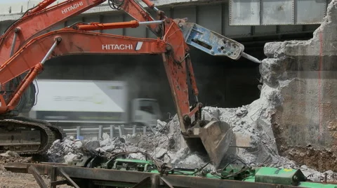 Back hoe and jack-hammer work on highway construction Stock Footage 49893065