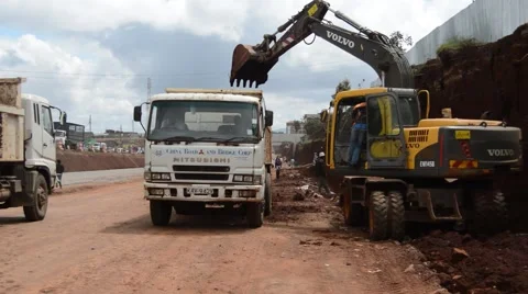 BACK-HOE-LOADING_Road Construction_Africa Stock Footage 47729269
