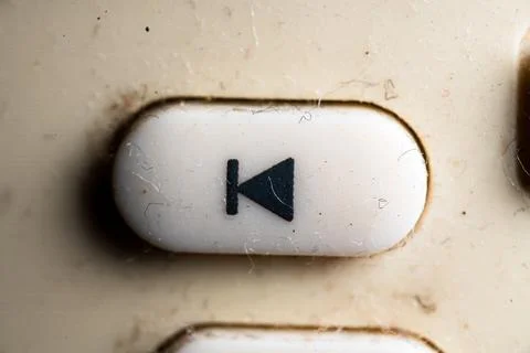 Back icon and button close up of a old Television remote controller Stock Photos