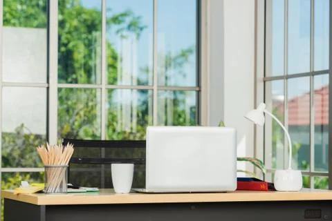 Back laptop computer putting on working desk Stock Photos