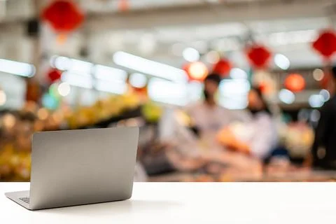 The back of the laptop or notebook computer is blank, placed on a white des.. Stock Photos