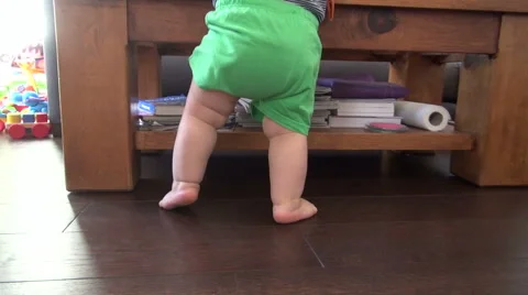 Back legs of standing baby Stock Footage 44122864