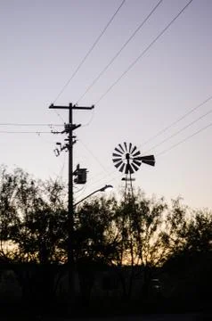 Back light windmill, shadow of a mill next to a lamppost, in the beautiful su Stock Photos