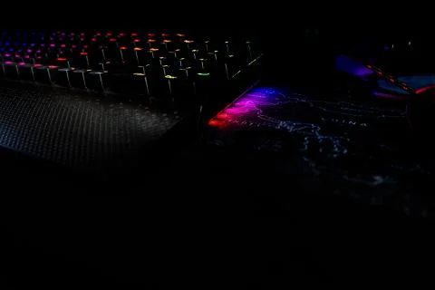 Back lighted computer gaming keyboard with RGB gradient colors, black space f Stock Photos