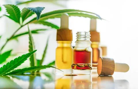 Back lit CBD or THC Cannabis oils, alternative medicine hemp products and mar Stock Photos