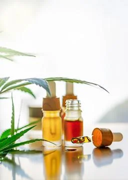 Back lit CBD or THC Cannabis oils, alternative medicine hemp products and mar Stock Photos