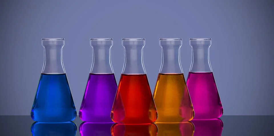 Back lit laboratory flasks in different colors Stock Photos