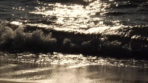 Back-lit Waves Splashing on Shore Slow-Motion Stock Footage 241671045