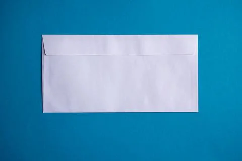 Back of Long, Rectangular White Envelope on Blue Background Foto stock