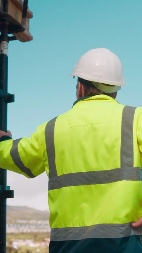 Back, man and construction worker by scaffolding with city view, thinking and Stock Footage 336223819