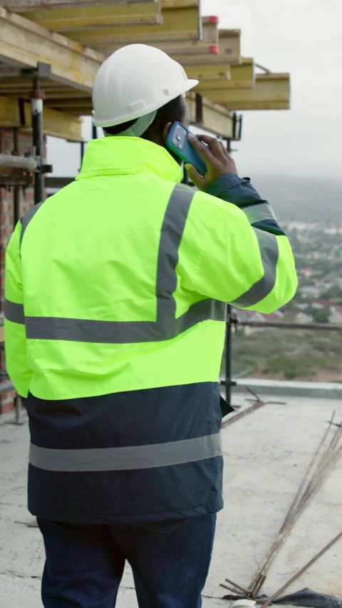 Back, man and engineer at site with phone call, inspection and planning for Stock Footage 338010477