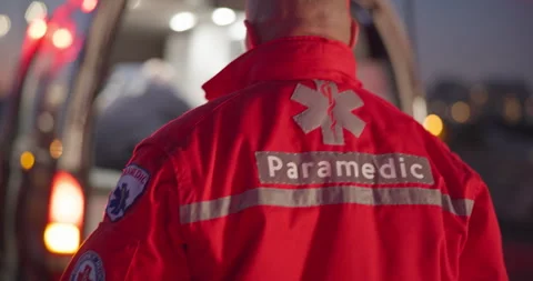 Back, man and paramedic walking to ambulance for emergency, ems service and 스톡 동영상 252661042