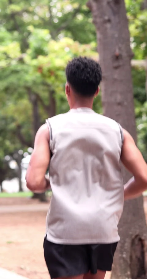Back, man and running at park for fitness, exercise and athlete training for Stock Footage 340812181