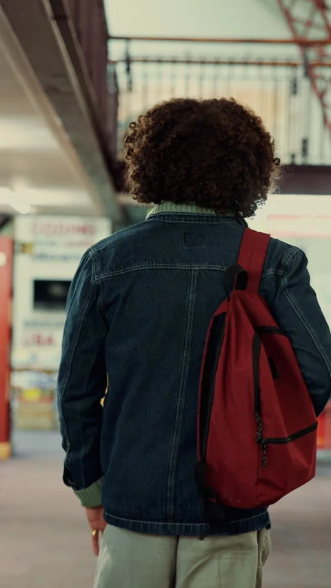 Back, man and student with backpack in library for education, study material and Stock Footage 335806959