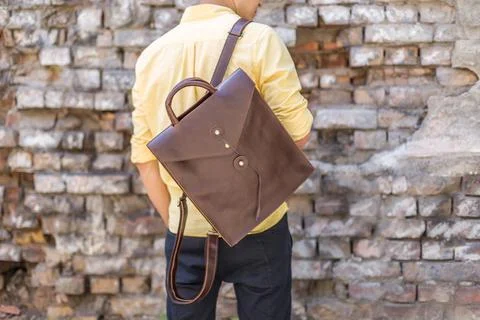 Back of man with brown leather backpack Stock Photos