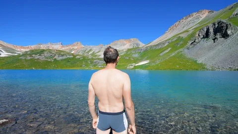 Back of man in Ice Lake in Silverton, Colorado summer seamless loop Stock Footage 130073015