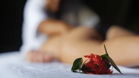 Back massage blurred with flowers Stock Footage 95301604