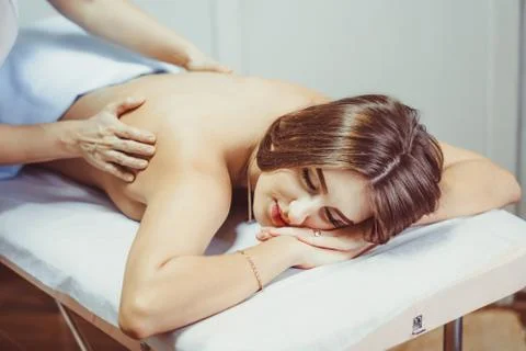 A back massage in the salon Stock Photos